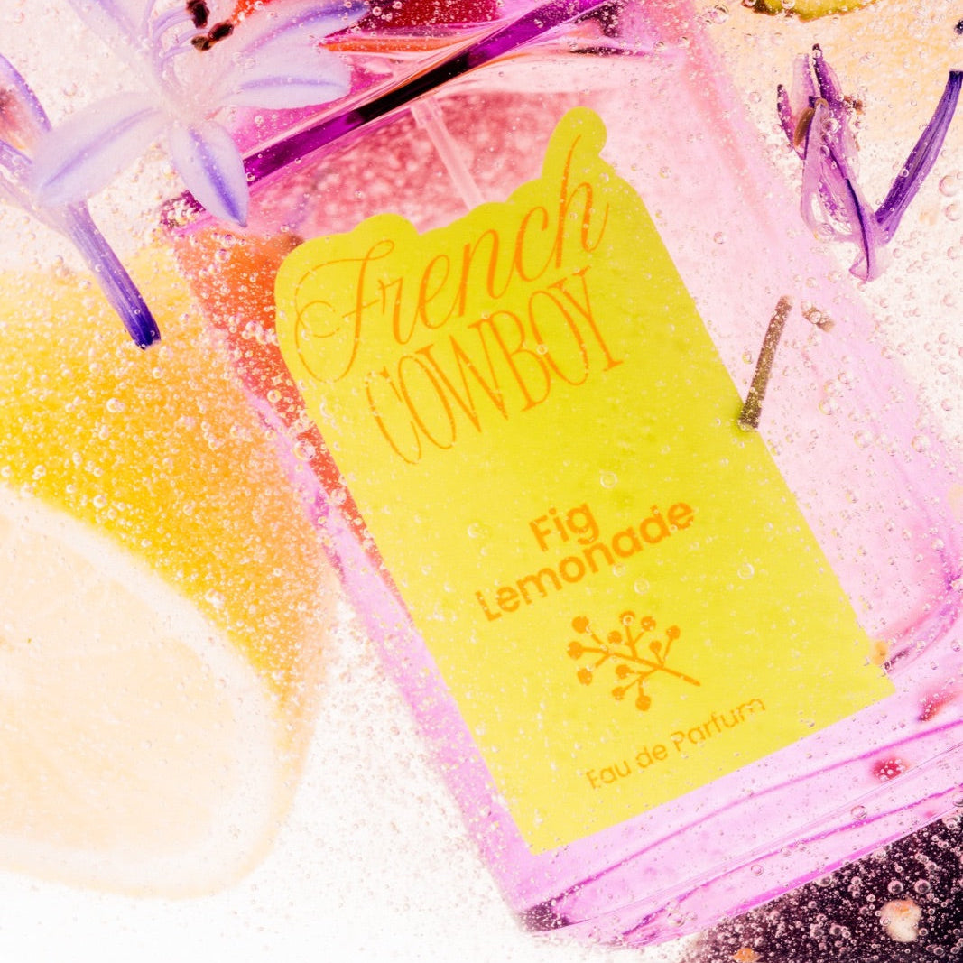 French Cowboy Fig Lemonade bottle with fig, lemon and bubbles