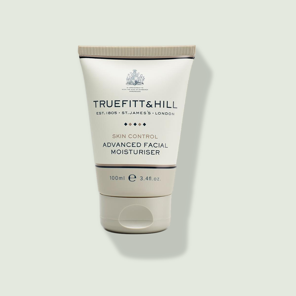 TRUEFITT & HILL Advanced Facial Moisturiser uz salvijas krāsas fona